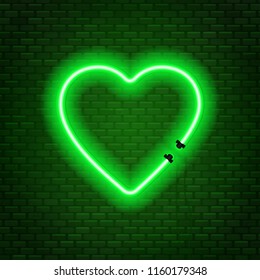 Neon tubes in the shape of a heart isolated on a brick wall background. Sign of love.