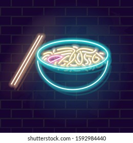 Neon udon noodles in bowl. Traditional japanese food with chopsticks. Glowing vector illustration on brick wall background.