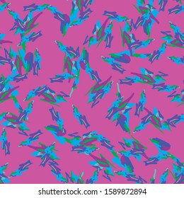 Neon UFO camouflage of various shades of pink, violet, green and blue colors. It is a colorful seamless pattern that can be used as a camo print for clothing and background and backdrop or wallpaper