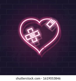 Neon wounded heart silhouette with crossed band patches. Fluorescent icon on brick wall background. Concept image for love relationship.