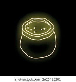 Neon yellow food container is glowing on a black background