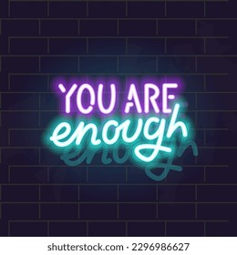 Neon you are enough lettering. Motivational glowing sign. Isolated illustration on brick wall background.