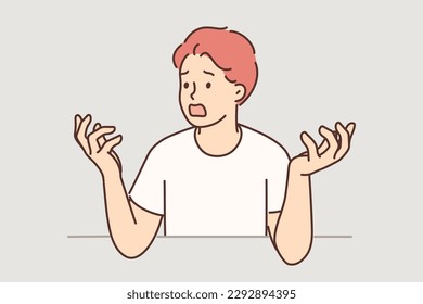 Nervous man throws up hands and opens mouth wide screaming and swearing after being disappointed by bad news. Shocked guy is frustrated with problems that have arisen and feels emotional stress