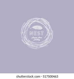 Nest Logo. Soft logo, comfort emblem. Luxury linen. bedding logo. Nest with feather on light background.