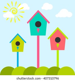 Nesting box cartoon set. Meadow with colorful bird houses. Nesting houses for birds and spring sun, flat cartoon style.