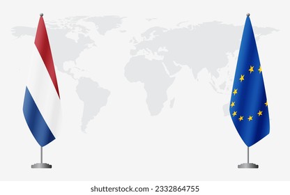Netherlands and European Union flags for official meeting against background of world map.
