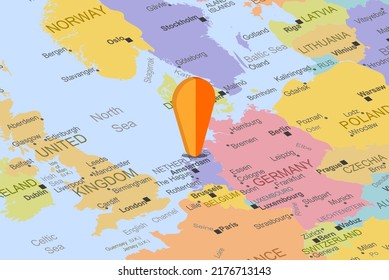 Netherlands with orange placeholder pin on europe map, close up Netherlands, vacation and road trip concept, pinned destination, travel idea, top view, colorful map with location icon