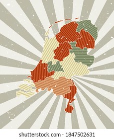 Netherlands vintage map. Grunge poster with map of the country in retro color palette. Shape of Netherlands with sunburst rays background. Vector illustration.