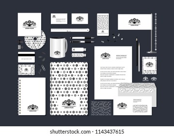 The neutral black-and-white corporate identity with the stylized tree. Samples of business cards, a disk, a flag, a pen, a flash card, a form, an envelope, a mug, a notepad, a pencil. Vector.