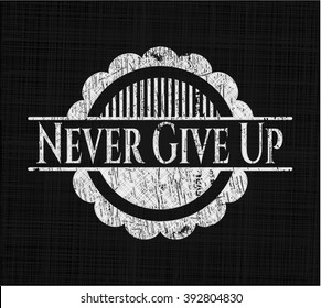 Never Give Up written on a chalkboard