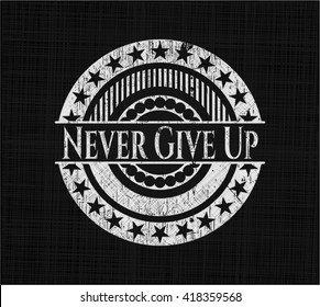 Never Give Up written on a chalkboard