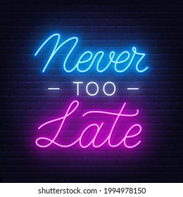 Never Too Late neon quote on a brick wall.