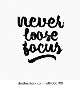 Never loose focus quote. Ink hand lettering. Modern brush calligraphy. Handwritten phrase. Inspiration graphic design typography element. Cute simple vector sign.