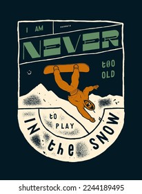 I'm never too old to play in the snow. Snowboarder doing extreme jump trick in front of the ice covered mountain peak. Distressed label winter sports vintage typography t-shirt print