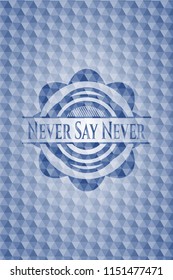 Never Say Never blue badge with geometric pattern.