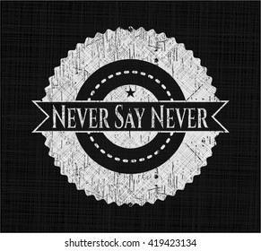 Never Say Never chalk emblem written on a blackboard