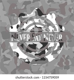 Never Say Never written on a grey camouflage texture