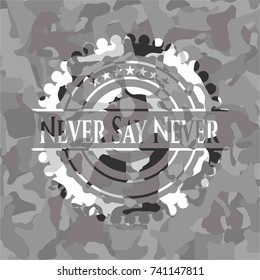 Never Say Never written on a grey camouflage texture