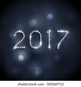 New 2017 year celebration festive background with diamonds and defocused lights