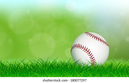 New baseball sitting on lush grass in front of a soft background