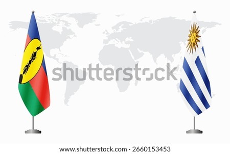 New Caledonia and Uruguay flags for official meeting against background of world map.