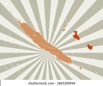 New Caledonia vintage map. Grunge poster with map of the country in retro color palette. Shape of New Caledonia with sunburst rays background. Vector illustration.