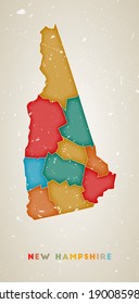 New Hampshire map. US state poster with colored regions. Old grunge texture. Vector illustration of New Hampshire with US state name.