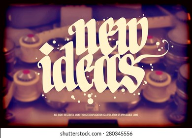 New idea, calligraphic handwritten text on blurred background