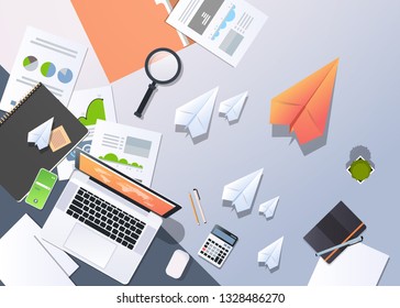 new idea inspiration creative process solution concept top angle view desktop laptop paper airplanes financial analysis document report office stuff horizontal