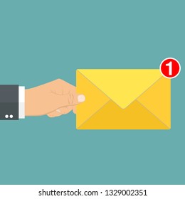 New, incoming message, sms. Hand holding envelope, letter. Delivery of messages, sms. Mail notification sending messages Coming messages
