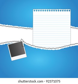  New paper sheet and photo on rip blue paper.