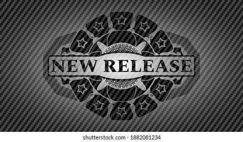 New Release text inside carbon fiber emblem. Polymer texture fancy background. Intense illustration. 