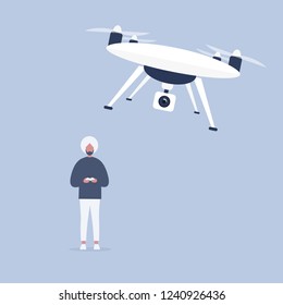 New technologies. Young indian character controlling a drone with a remote controller / flat editable vector illustration, clip art