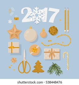 New Year 2017 decorations set  in flat modern style. Ornaments and gift boxes  in gold from flat lay top view.