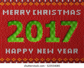 New Year 2017 as hole in knitted background. Fragment of knitwear with year number and christmas wishes