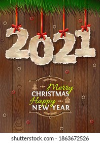 New Year 2021 of crumpled paper against wood background. Paper numbers with torn edge on ribbon