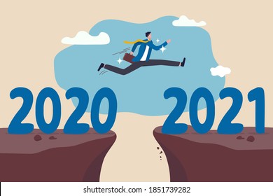 New year 2021 hope for business recovery, change year from 2020 to 2021 calendar or new challenge coming concept, confident success businessman attempt to jump high overcome risk to next cliff.