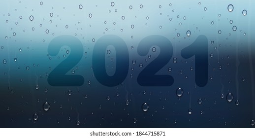 new year 2021 written on sweaty window,blurred background