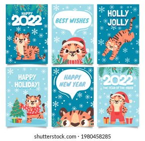 New year 2022 cards. Merry christmas poster with cartoon tiger decorate tree. Baby tigers in santa hat. Happy holidays greeting vector set. 2022 holiday banner graphic, wildlife character illustration