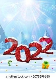 New Year 2022 in shape of knitted fabric in snow. Winter landscape with year number, top lighting