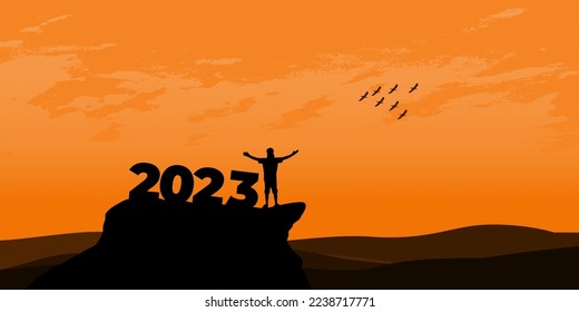 New Year 2023 concept. Man meets dawn in mountains for new year 2023. New Start motivation inspirational quote message on silhouette man