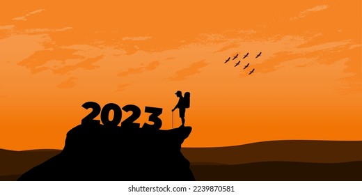 New Year 2023 concept. Man meets dawn in mountains for new year 2023. New Start motivation inspirational quote message on silhouette man