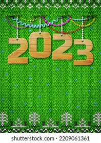 New Year 2023 of wood as christmas decoration. Christmas knitted background with copy space