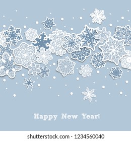 New Year background.  Carved snowflakes on a pale blue background.