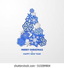 New year background with Christmas tree made of blue 3d snowflakes. 