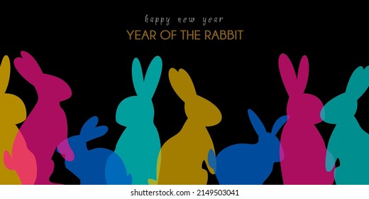 New Year banner. 2023. Year of the rabbit. On a black background. Rabbit silhouettes. For websites. Horizontal. Happy New Year.