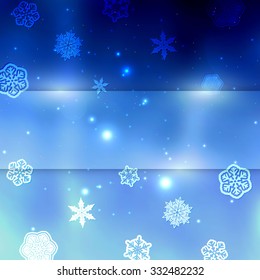 New year blue blurred background with snowflakes