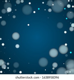 New year blurred bokeh lights holiday decoration. White abstract snowflakes over dark blue background. Blurred bokeh lights flare effect circle random dust New year card pattern