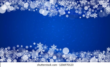 New Year border on blue background. Horizontal winter theme. Christmas and New Year border with snowflakes  falling. For season sales, special offer, banners, cards, party invites, flyers. White snow