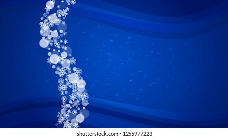 New Year border on blue background. Horizontal winter theme. Christmas and New Year border with snowflakes  falling. For season sales, special offer, banners, cards, party invites, flyers. White snow